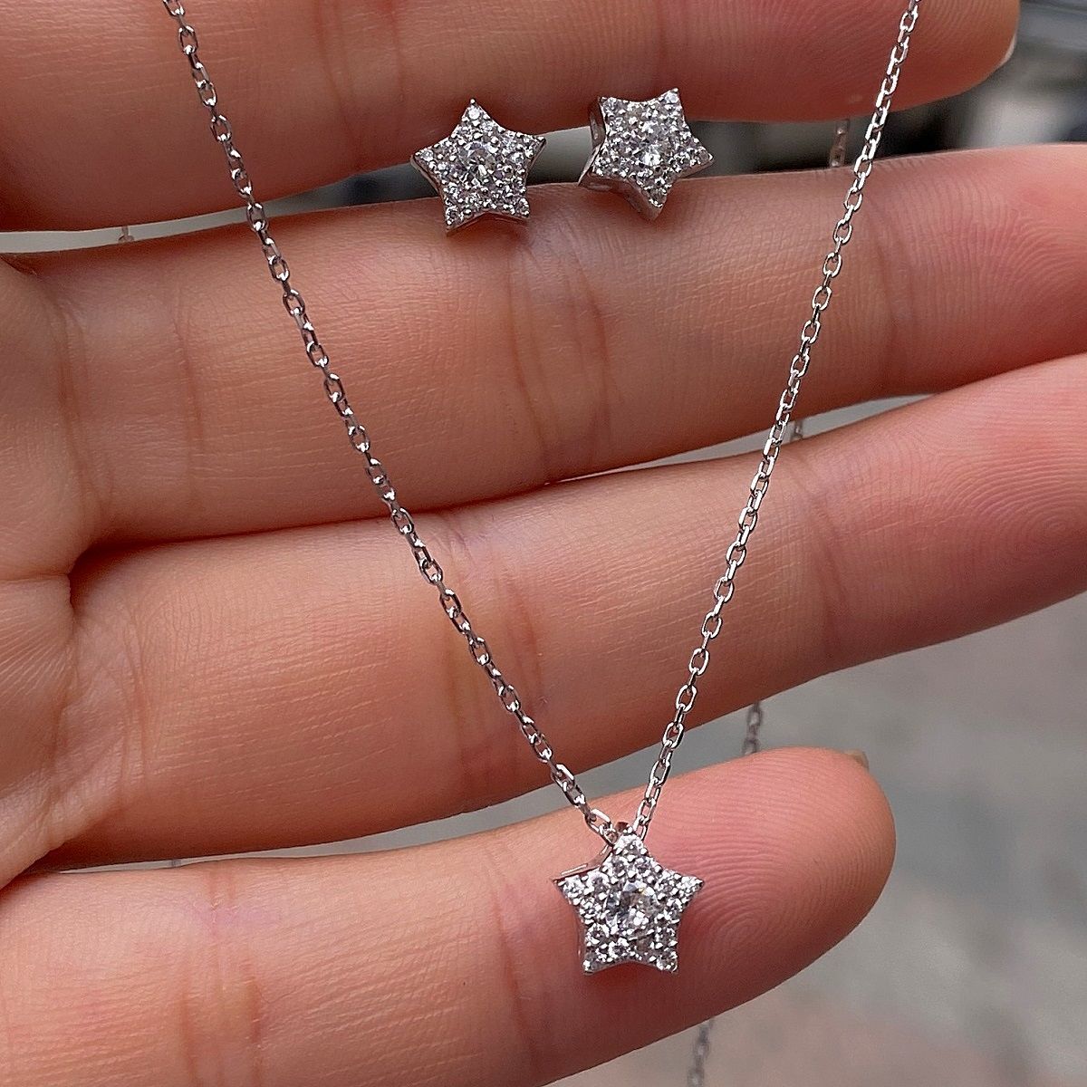 Gümüş yıldız model küpe ve kolye ucu is12e14